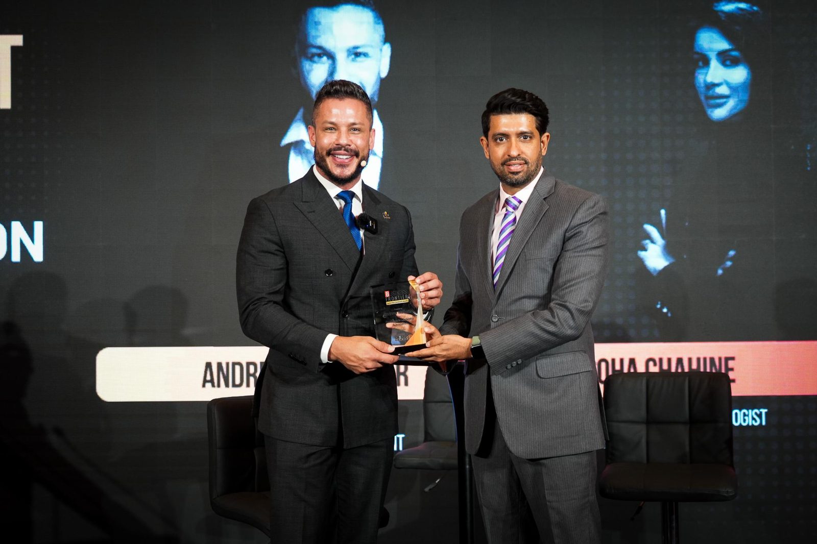 Andrew Wolhuter receiving a Business Frontier award on stage